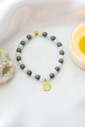 Bracciale Elastico in Ematite con Ciondolo Fiore di Loto 24K