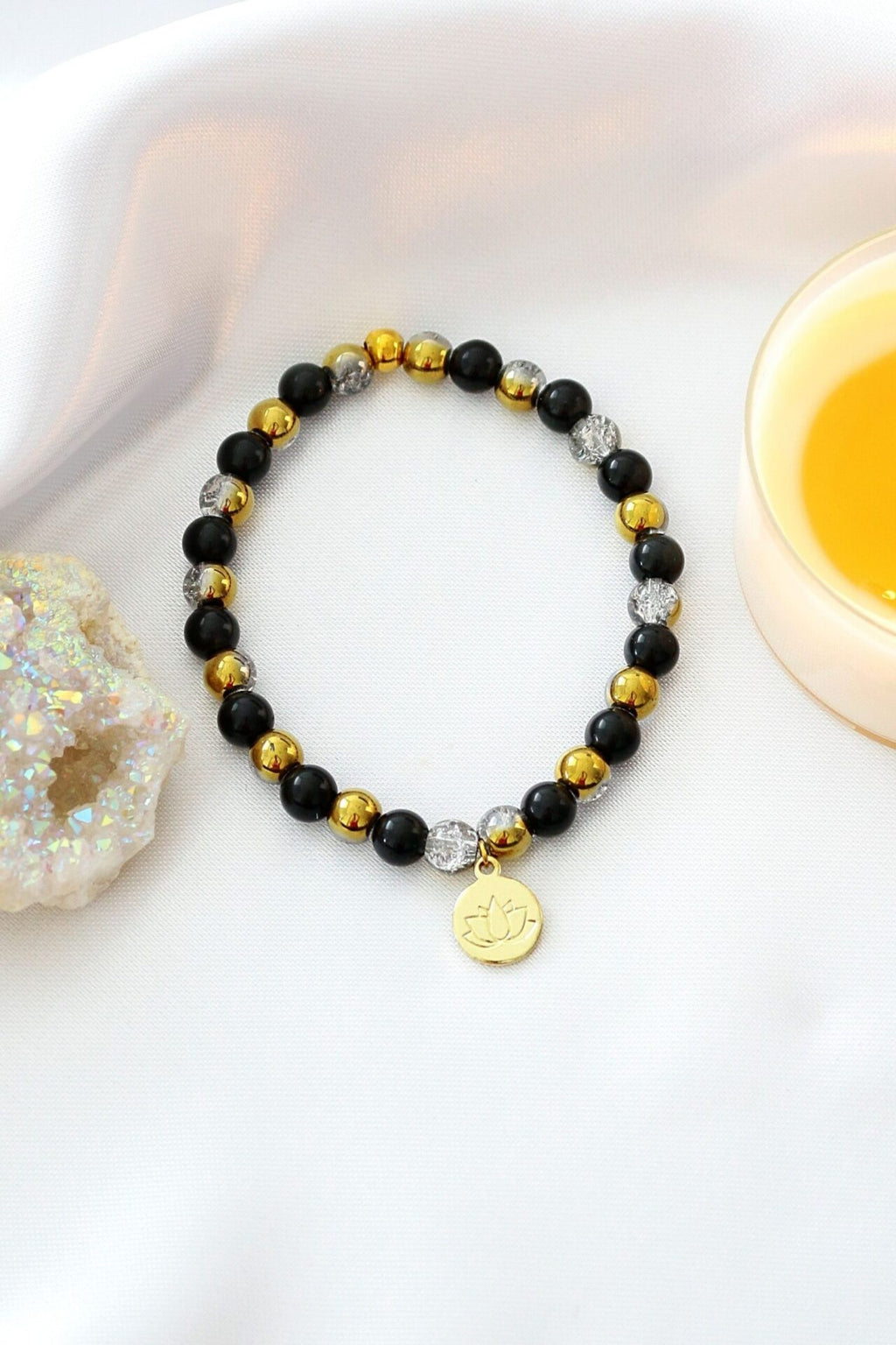 Bracciale Elastico in Ossidiana con Ciondolo Fiore di Loto 24K