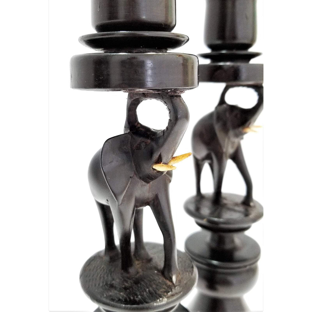 A pair of Elephant Curved Ebony Candle Holders
